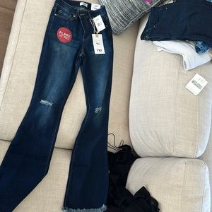 Size 3 tummy control flare stretchy denim jeans. 32 inseam. Tags on never worn